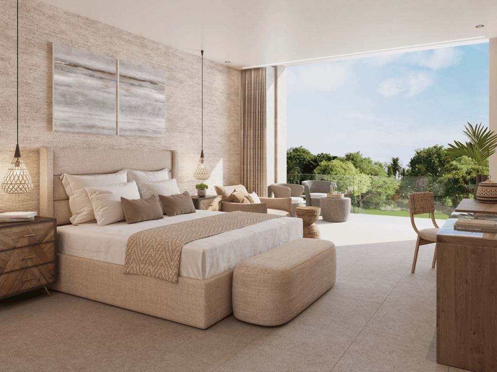 Bright, modern resort bedroom with terrace seating and lush garden view.