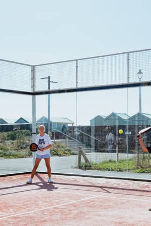 Two players enjoying padel at Hove Beach Park in Brighton.