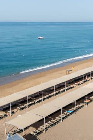 Private sandy beach and Mediterranean Sea at Megasaray Resort Side.