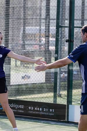 Padel partners celebrating a point at Club Esportiu Laietà in Barcelona