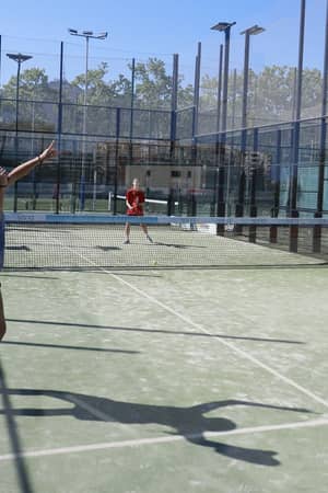 Four players in a padel match on an outdoor court at Club Esportiu Laietà