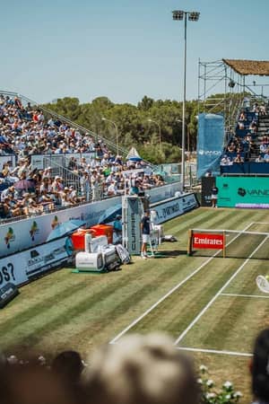 A packed Mallorca Championships centre court during a grass-court tennis match.