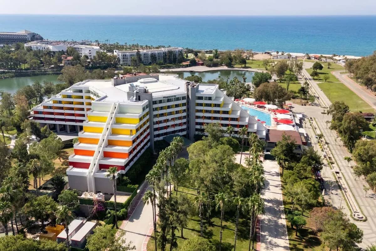 Aerial view of Megasaray Resort Side with the hotel, lagoon and Mediterranean coast beyond.