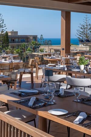 Open-air Meat In restaurant terrace at Nana Golden Beach overlooking the resort and sea.