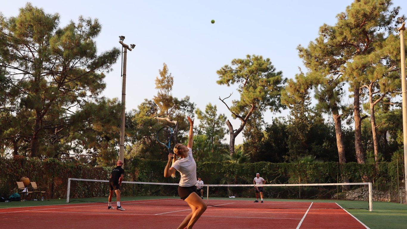 Liberty Lykia Adult Only player serving on clay