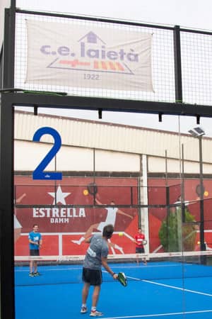 Players on an outdoor padel court at Club Esportiu Laietà in Barcelona