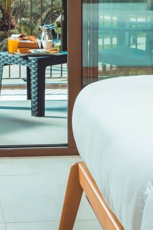 Balcony seating in a Standard Sea View room at Paloma Orenda