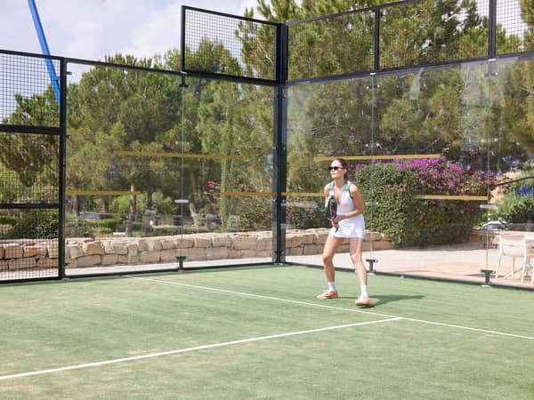 Padel player on court at Aphrodite Hills Racket Club