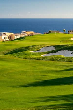 Villas at Aphrodite Hills Resort in Cyprus overlooking a golf course and the Mediterranean Sea.