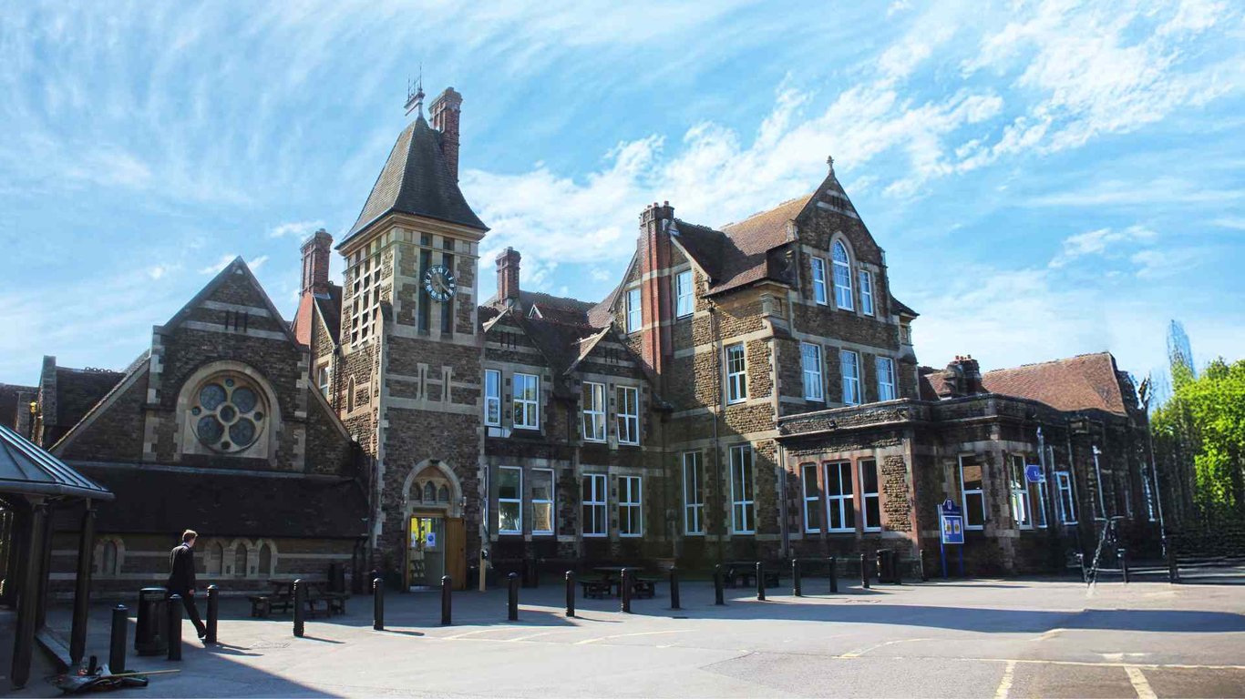 Churcher's College main building with historic gothic architecture and a clock tower.