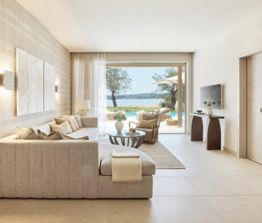 Luxurious bungalow suite at Ikos Odisia with a modern living room, private pool, and view of the sea.