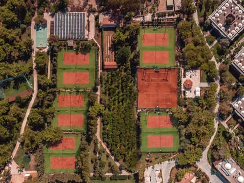 Tennis courts within the landscaped grounds of Paloma Orenda