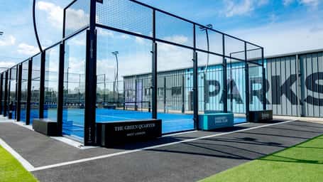 Outdoor padel tennis court at Parkside, West London, part of Active Away's clinic with glass enclosures and modern amenities.