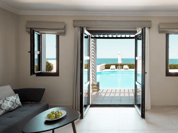 Royal Mare Junior Suite with private pool, sea view, and elegant interior furnishings.