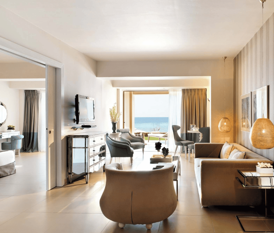 Two-bedroom family suite at Sani Beach with ocean view, featuring stylish living area and beach access.