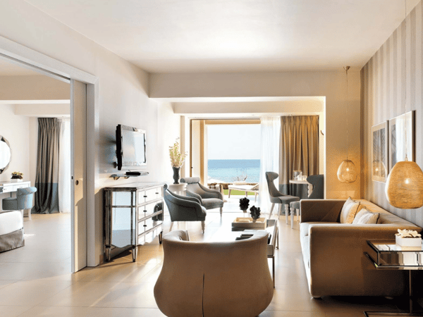 Two-bedroom family suite at Sani Beach with ocean view, featuring stylish living area and beach access.