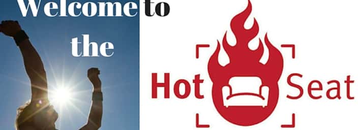 Header graphic showing 'Welcome to the Hot Seat' with a person throwing a ball in the sunlight.