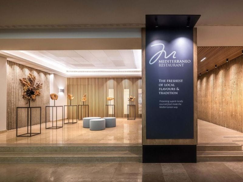 Entrance to Mediterraneo Restaurant in Valamar Gallery, displaying modern art and contemporary design elements with a focus on Mediterranean cuisine.