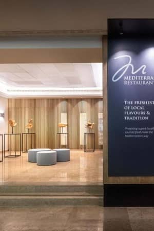 Entrance to Mediterraneo Restaurant in Valamar Gallery, displaying modern art and contemporary design elements with a focus on Mediterranean cuisine.