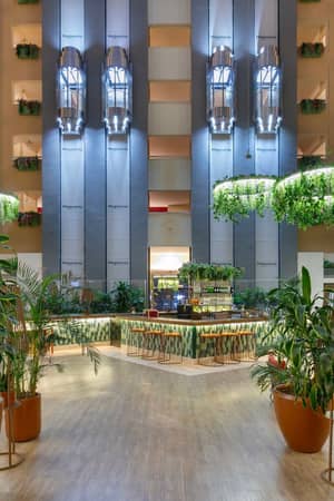 Plant-filled lobby atrium at Megasaray Resort Side.