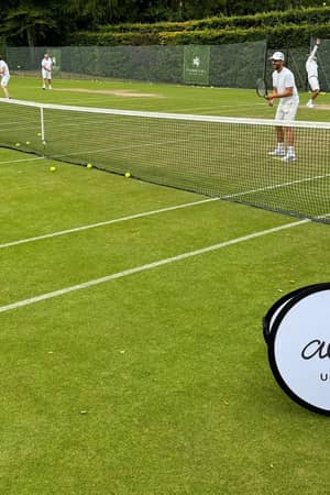 Active Away players training on the grass courts at St George's Hill Lawn Tennis Club.