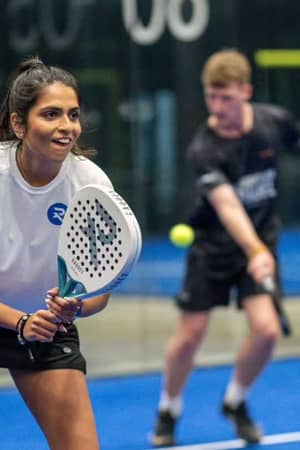 Padel players on court at Advantage Padel Mudeford